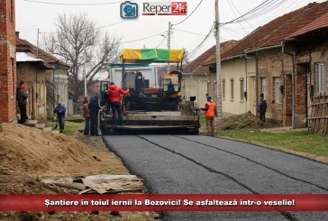 Șantiere în toiul iernii la Bozovici! Se asfaltează într-o veselie!
